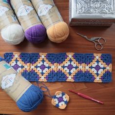 crochet supplies laid out on a wooden table