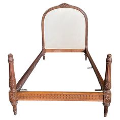 an antique wooden bed frame with mirror on the headboard and foot board, isolated against a white background