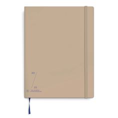 a beige notebook on a white background with blue string attached to the front and side