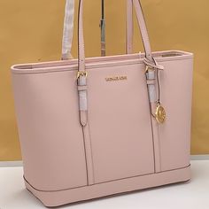 Michael Kors Jet Set Travel Large Top Zip Shoulder Tote Saffiano Leather Powder Blush Nwt 100% Authentic Style# 35f0gtvt9l Was $448.00$ Mk Note: Our Jet Set Travel Tote Is A Timeless Style For Every Season. Crafted From Saffiano Leather Accented With A Top-Stitch Trim, It Opens To A Spacious Interior With Plenty Of Room To Store All Your Essentialsbe It For A Day Or For An Entire Weekend. Use The Inside Slip Pocket To Stow Small Items That Require Easy Access. Details Tote Bag Saffiano Leather 1 Mk Tote Bag, Black Tote Purse, Grey Tote Bags, Large Leather Tote Bag, Michael Kors Tote Bags, Pink Tote Bags, Large Leather Tote, White Tote, Travel Bug