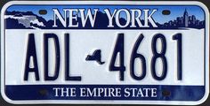 new york license plate with the empire state in blue, white and black on it