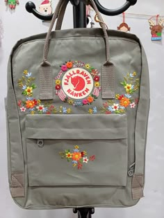 Welcome to my store and choose the perfect hand-embroidered fjallraven kanken backpack   Version & Size + Medium size: 38x27x13cm  + Big size: 42x32x13cm  - Product price includes: hand-embroidered fjallraven kanken backpack and design as shown in the picture - I can make fjallraven kanken backpack hand embroidery patterns according to your ideas - fjallraven kanken backpack will be hand embroidered with thread that won't fade when washed - fjallraven kanken backpack has a small front compartmen Embroidery Backpack Ideas, Fjallraven Embroidery, Hand Embroidered Backpack, Fjällräven Kånken Embroidery, Kanken Embroidery, Backpack Embroidery, Custom Fjallraven Kanken, Kanken Flower Embroidery