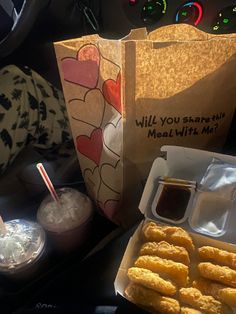 some food and drinks on a table in a car