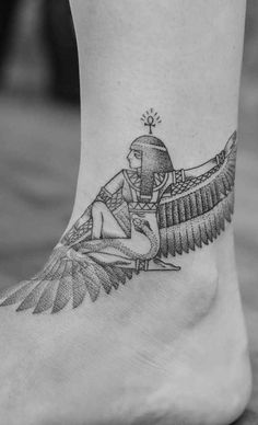 an egyptian tattoo on the foot