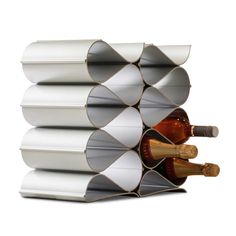 the wine rack is made out of white paper and has four bottles in each section