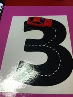 the number five is made out of paper with cars on it