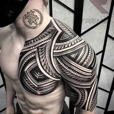 a man's upper half sleeve with an intricate tattoo design on his left arm