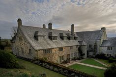 an aerial view of a large stone house