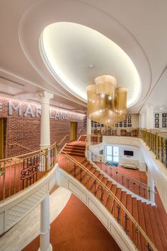 the interior of a large building with many stairs and railings on each side of it