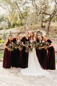 a bride and her bridesmaids with their bouquets