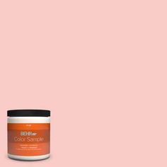 the behr paint color is shown in an orange hue, and it has a black lid