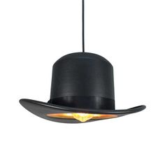 a black hat hanging from the ceiling with lights on it's sides and an orange light in the center