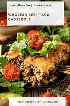 a close up of a plate of taco casserole with tomatoes and lettuce