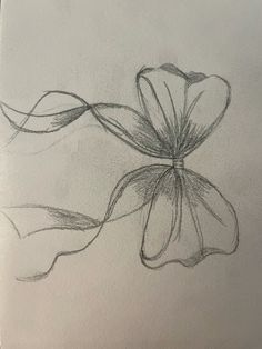 a pencil drawing of a flower with long, thin lines on the bottom half of it