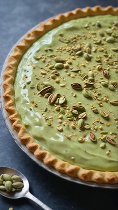 there is a pie with pistachios on it