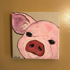 a painting of a pig's face on a wall