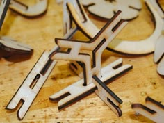 several pieces of wood cut into shapes on a table