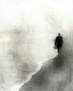 a black and white photo of a man walking on the beach in the foggy water