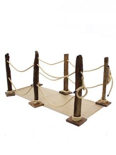 three wooden posts with ropes attached to them on top of each other in front of a white background