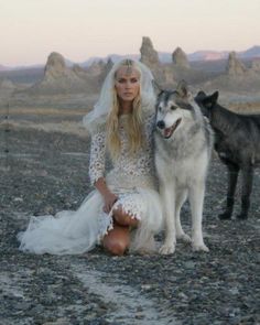 a woman sitting next to a dog on top of a rocky ground with a quote written below