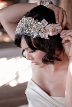 a woman wearing a bridal hair piece