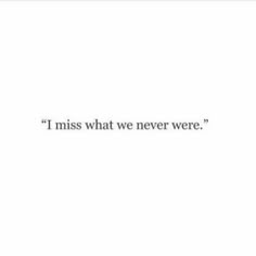 the words i miss what we never were are written in black on a white background