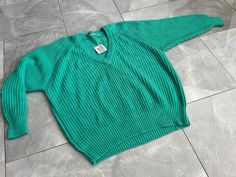 "Vintage 90s style chunky knit v neck sweater. No tag indicating maker, material, or size.  MEASUREMENTS (LAYING FLAT): Pit to pit 23\" Length 23\" Collar to Sleeve cuff 26\"" Knit V Neck Sweater, Vintage 90s Style, Knit V Neck, Chunky Knit Sweater, Sleeve Cuff, 90s Style, Chunky Knits Sweater, Black Mini, Fur Jacket