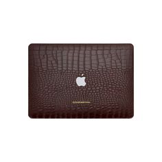 an apple macbook pro case in brown crocodile leather with the logo on the front