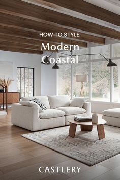 a modern coastal living room with white furniture and wood beams on the ceiling, is featured in an article about how to style modern coastal