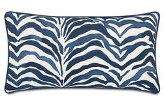 a blue and white zebra print pillow on a white background