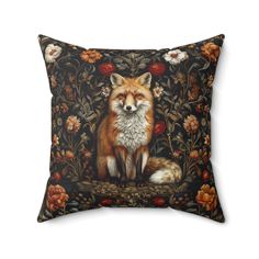 a pillow with a fox and flowers on it