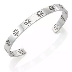 Tory Burch Silver Signature T Logo Pierced Cuff Bracelet Whether Worn Alone Or Stacked With Other Styles, It’s An Effortless Way To Accessorize Your Everyday Wardrobe. Stainless Steel. Signature Double-T Logo Cutouts. Gap For Slip-On Style Measurement: Diameter: 2.5”/ 6.5cm Width: 0.25” /0.5cm Condition: New Without Tag It Doesn’t Come With Tory Burch Pouch, Bracelet Only. Come W. Jewelry Pouch & Box. Retail: $128+ Tax Tory Burch Bracelet Silver, Nickel-free Southwestern Style Bangle, Nickel-free Southwestern Bangle Cuff Bracelet, Tory Burch Jewelry, Silver Cuff Bangle, Cuff Bangle Bracelet, Cuff Bangles, Silver Cuff, Everyday Wardrobe