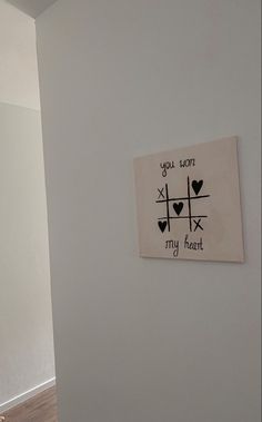 a white wall with a sign that says you took my heart and two hearts on it