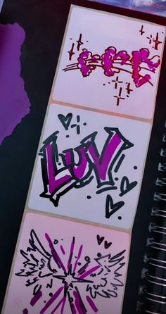 graffiti on the side of a wall next to a spiral notebook with pink and purple writing