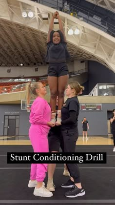 three women standing on top of each other in front of a basketball court with the words stunt conditioning drill