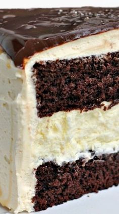 a piece of chocolate cake with white frosting