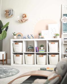 a living room filled with furniture and storage containers