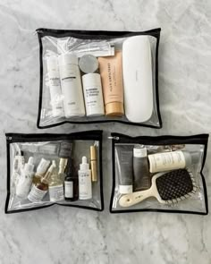 three bags filled with personal care items on a marble surface