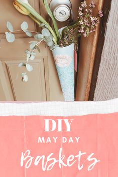 some flowers are sitting in a vase next to a sign that says diy may day baskets