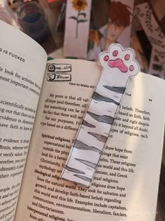 an open book with some stickers on it