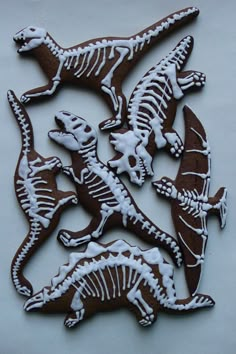 some cookies are decorated with different types of animals and skeleton designs on them, as well as snow