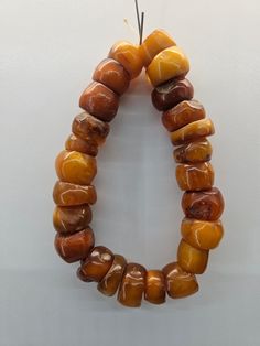 Antique Amber Jewelry With Large Beads, Vintage Amber Polished Beads, Gems, And Cabochons, Amber Spiritual Round Beads, Antique Amber Round Bead Jewelry, Vintage Amber Gemstone Beads, Antique Amber Beads For Gift, Antique Amber Beads For Jewelry Making, Vintage Amber Hand-strung Beads, Gems, And Cabochons, Traditional Amber Round Beads And Cabochons