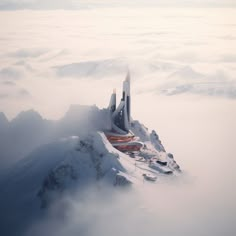 a building on top of a mountain surrounded by clouds