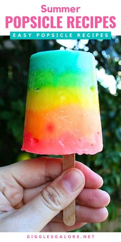 Layered Rainbow Popsicle. With Text Reading: 15 Homemade Popsicle Recipes. Homemade Popsicles For Kids, Smoothie Popsicles Recipes, Popsicle Recipes For Kids, Jello Pudding Pops, Iced Coffee Popsicles, Homemade Popsicle Recipes, Popsicle Recipe For Kids, Lemon Popsicles, Fruit Popsicle Recipes