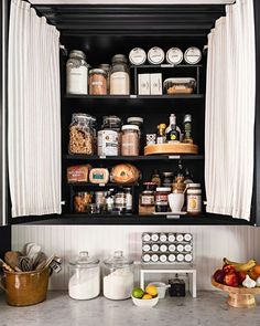 an organized pantry with lots of food and condiments