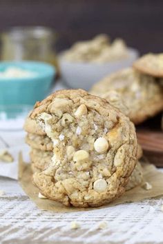 two cookies are stacked on top of each other with white chocolate chips in the middle