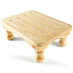 a small wooden table sitting on top of a white floor