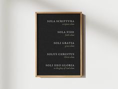 a black and gold framed menu hanging on the wall