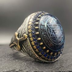 Introducing the stunning Solomon's Seal Sword Model Blue Agate Stone Ring!  This noble ring features a mesmerizing blue agate stone with a beautifully engraved Solomon's seal design.  Symbolizing power and protection, this unique accessory adds a touch of mystique to any outfit. Perfect for those who seek to channel strength and energy, this exquisite ring is sure to make a statement wherever you go.  Elevate your style and embrace your inner strength with the Solomon's Seal Sword Model Blue Aga Blue Aga, Tattoo Sailor, Embroidered Ring, Man Rings, Solomons Ring, Gem Rings, Seal Of Solomon, Blue Agate Stone, Solomons Seal