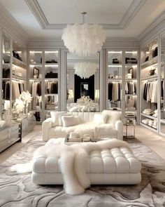 a white living room filled with furniture and lots of closet space next to each other